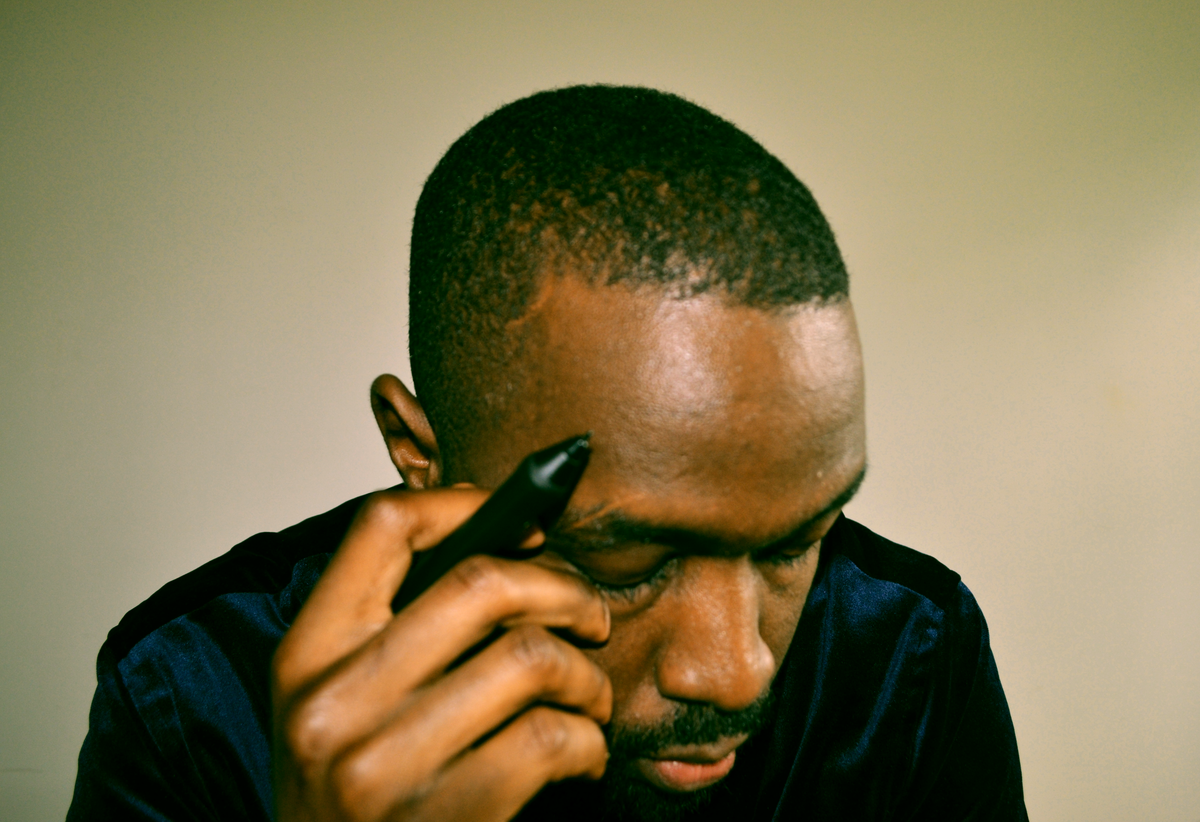 Šhema thinking deeply about ideas to be turned into a visual concept for an artwork he will be working on