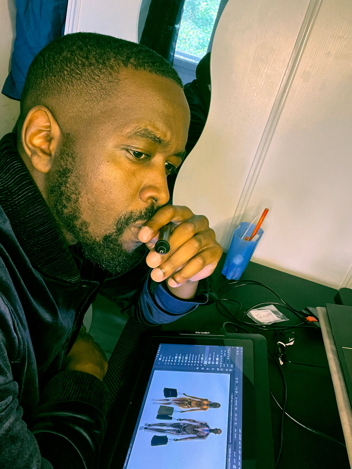 Šhema contemplating about how he can expand his conceptual idea for the artwork he is working on